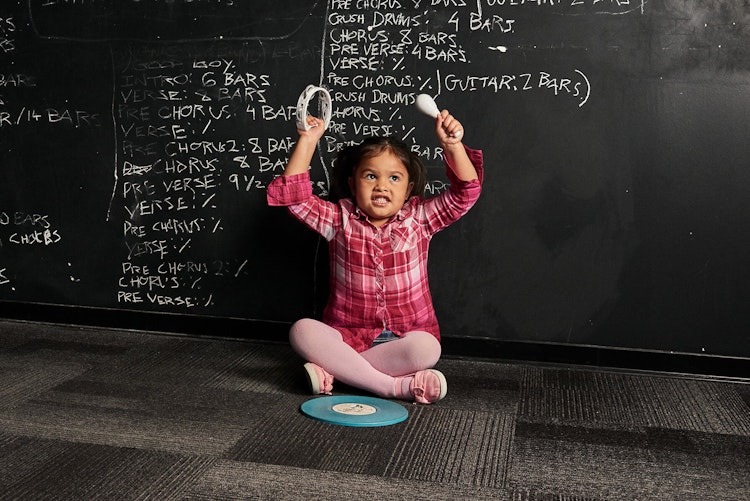 Student playing percussion in the Little Wing music program